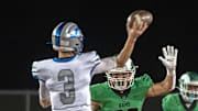 St.Mary's Elias Franco, right, puts pressure on Rocklin quarterback Reeve Slone during the Sac-Joaquin Section Division II football championship game at Hughes Stadium in Sacramento on Nov. 25, 2023. Rocklin won 17-6.