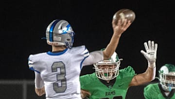 St.Mary's Elias Franco, right, puts pressure on Rocklin quarterback Reeve Slone during the Sac-Joaquin Section Division II football championship game at Hughes Stadium in Sacramento on Nov. 25, 2023. Rocklin won 17-6.