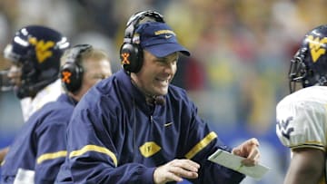 Jan 2, 2006: Atlanta, GA, USA: West Virginia Mountaineers running back (10) Steve Slaton is congratulated by head coach Rich Rodriguez after running 50 yards for a touchdown.