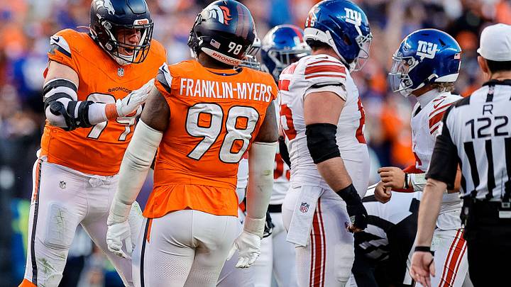 Oct 19, 2025; Denver, Colorado, USA; Denver Broncos defensive end Zach Allen (99) celebrates his sack with defensive end John Franklin-Myers (98) in the fourth quarter against the New York Giants at Empower Field at Mile High. 