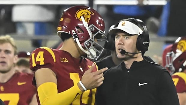 Nov 23, 2024; Pasadena, California, USA; DUPLICATE***USC Trojans quarterback Jayden Maiava (14) and head coach Lincoln Riley 