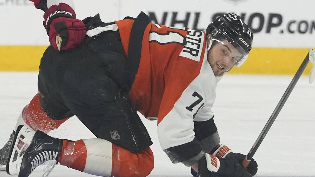 May 9, 2026; Philadelphia, Pennsylvania, USA; Philadelphia Flyers right wing Tyson Foerster (71) reaches for the puck against Carolina Hurricanes center Jordan Staal (11) during the second period in game four of the second round of the 2026 Stanely Cup Playoffs at Xfinity Mobile Arena. Mandatory Credit: James Lang-Imagn Images