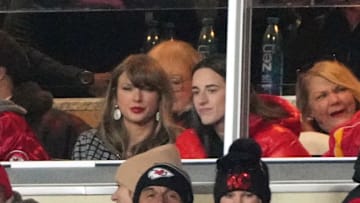 Taylor Swift sits with Indiana Fever guard Caitlin Clark during the 2025 AFC divisional game between the Kansas City Chiefs and Houston Texans 