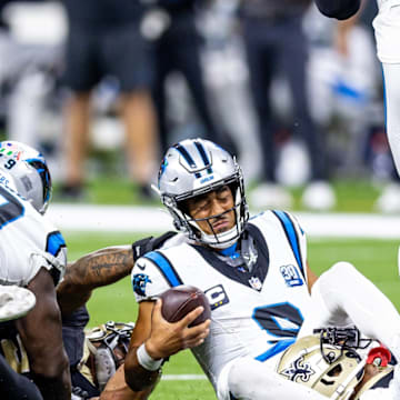 Sep 8, 2024; New Orleans, Louisiana, USA; Carolina Panthers quarterback Bryce Young (9) is tackled as he scrambles out the pocket by New Orleans Saints cornerback Alontae Taylor (1) during the second half at Caesars Superdome.