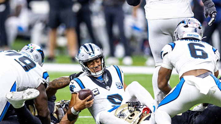 Sep 8, 2024; New Orleans, Louisiana, USA; Carolina Panthers quarterback Bryce Young (9) is tackled as he scrambles out the pocket by New Orleans Saints cornerback Alontae Taylor (1) during the second half at Caesars Superdome.