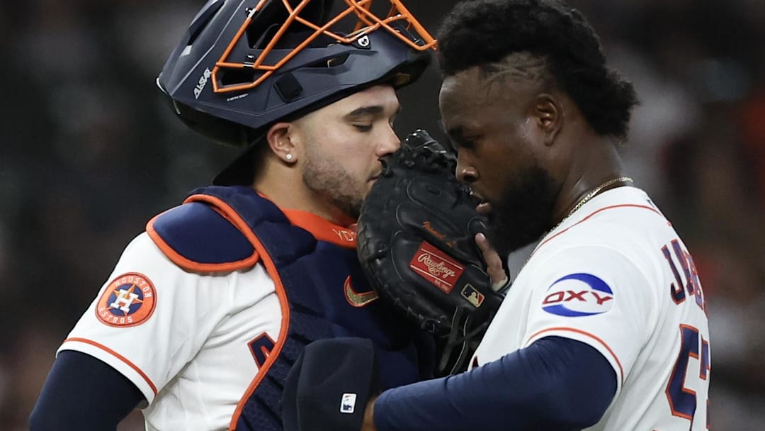 Houston Astros catcher Yainer Diaz (21) talks to starting pitcher Cristian Javier (53) after Los Angeles Angels designated hitter Jorge Soler (12, not pictured) hit a two-run home run in the fourth inning at Daikin Park.