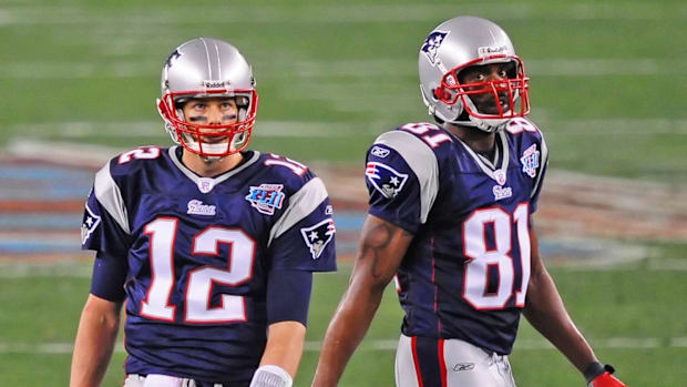 Feb 3, 2008; Glendale, AZ, USA; New England Patriots quarterback (12) Tom Brady and wide receiver (81) Randy Moss against the