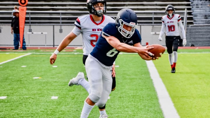 Liberty Christian's Joey Isley scores a touchdown in the Patriots' win over Neah Bay in Everett. Liberty Christian's Joey Isley scores a touchdown in the Patriots' win over Neah Bay in Everett.