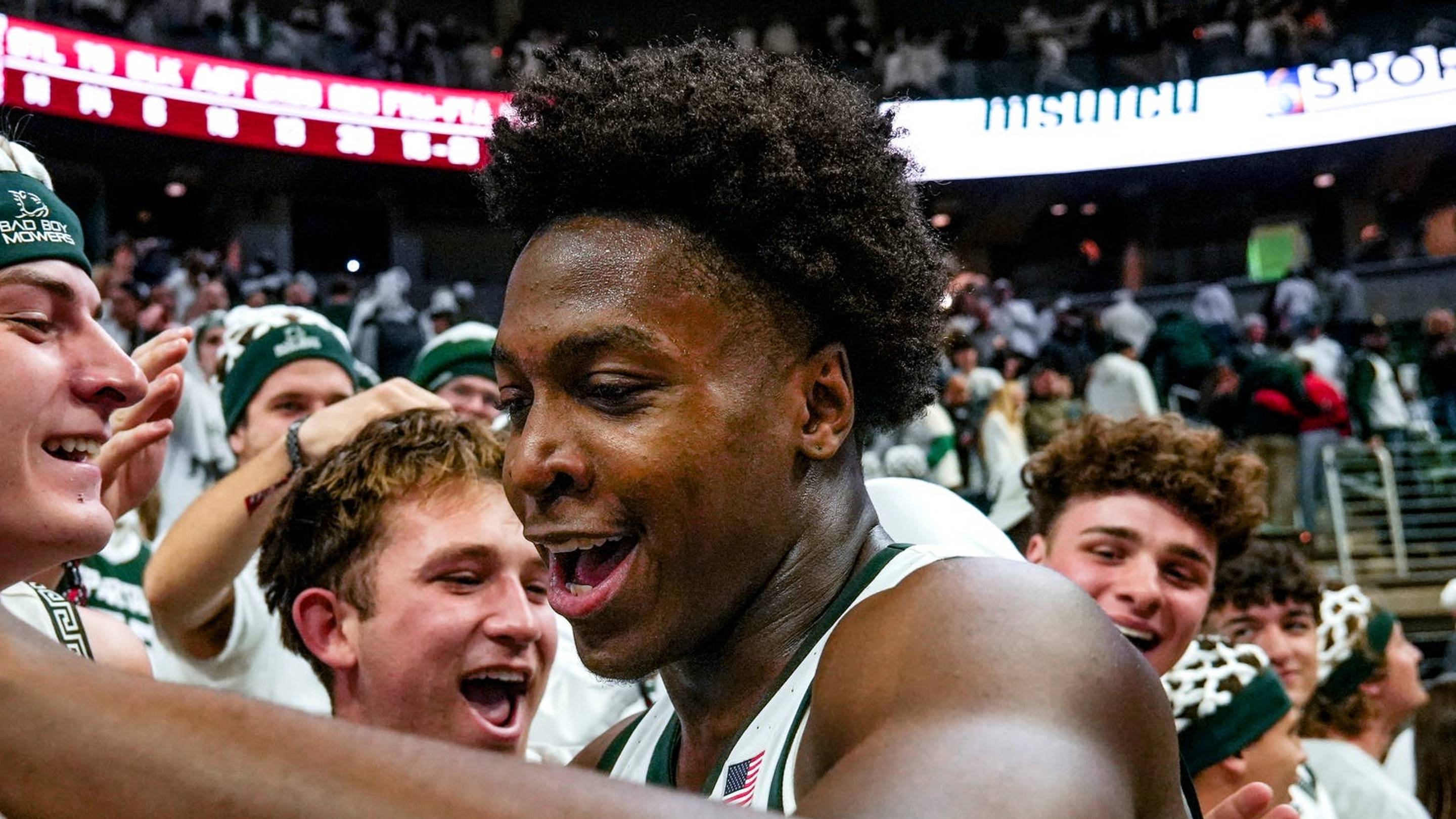 Michigan State's Cam Ward celebrates with fans after the Spartans victory over Arkansas on Saturday, Nov. 8, 2025, at the Breslin Center in East Lansing.