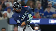 Oct 20, 2025; Toronto, Ontario, CAN; Seattle Mariners third baseman Eugenio Suarez (28) singles in the second inning against the Toronto Blue Jays during game seven of the ALCS round for the 2025 MLB playoffs at Rogers Centre. Mandatory Credit: Nick Turchiaro-Imagn Images
