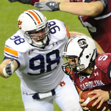 Dec 4, 2010; Atlanta, GA, USA; South Carolina Gamecocks quarterback Stephen Garcia (5) scrambles away from Auburn Tigers defensive tackle Zach Clayton (98).