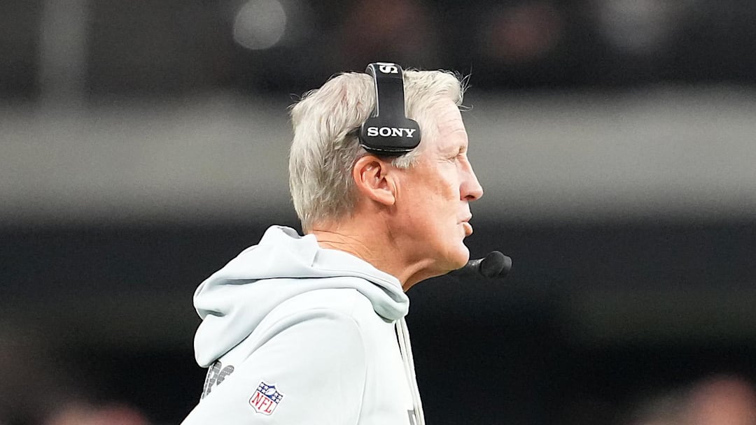 Nov 23, 2025; Paradise, Nevada, USA; Las Vegas Raiders quarterback Geno Smith (7) walks away from head coach Pete Carroll in a game against the Cleveland Browns during the fourth quarter at Allegiant Stadium. Mandatory Credit: Stephen R. Sylvanie-Imagn Images