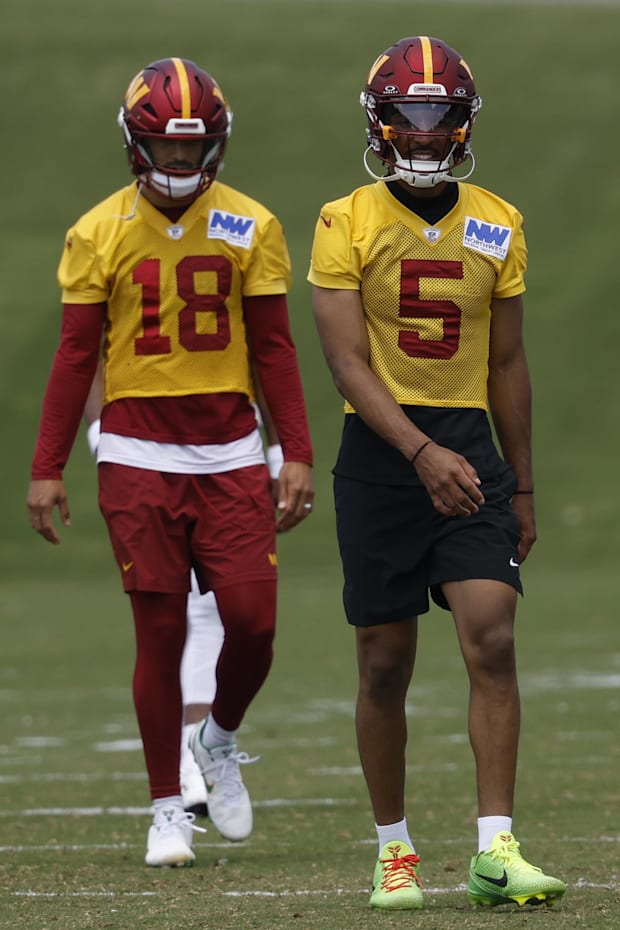 Washington Commanders quarterback Jayden Daniels and Commanders quarterback Marcus Mariota