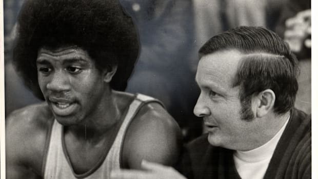 Earvin "Magic" Johnson with his high school coach George Fox at Lansing Everett High School.