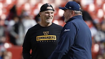 Nov 24, 2024; Landover, Maryland, USA; Washington Commanders head coach Dan Quinn (L) talks with Dallas Cowboys head coach Mike McCarthy (R) on the field during warmup prior to their game at Northwest Stadium. Mandatory Credit: Geoff Burke-Imagn Images