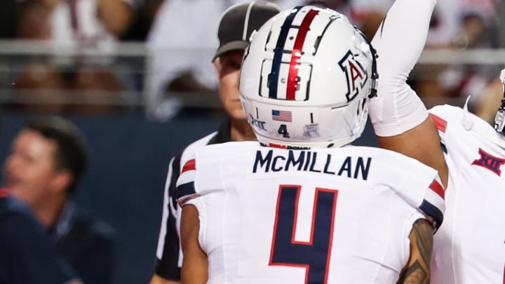 Aug 31, 2024; Tucson, Arizona, USA; Arizona Wildcats wide receiver Tetairoa McMillan (4) celebrates a touchdown with Arizona Wildcats quarterback Noah Fifita (11) against the New Mexico Lobos during the first quarter at Arizona Stadium