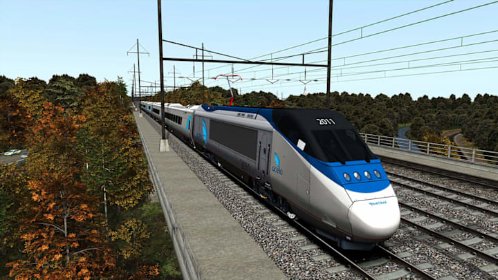 A 2011 train going along the tracks.