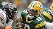 Green Bay Packers running back Josh Jacobs (8) rushes against the Chicago Bears last season.