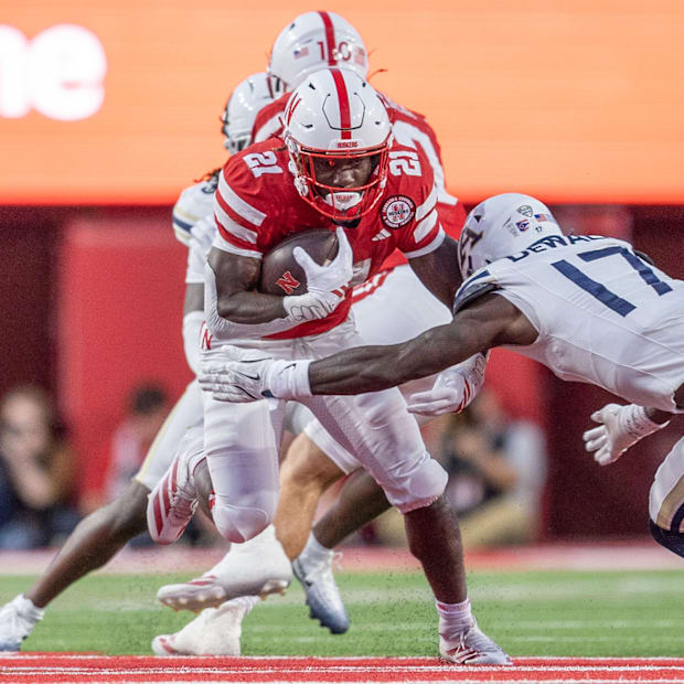 Nebraska running back Emmett Johnson picks up 10 yards on a rush against Akron.
