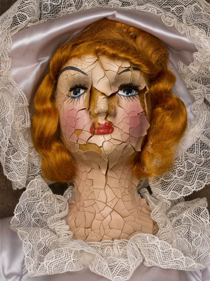 cracked old doll head