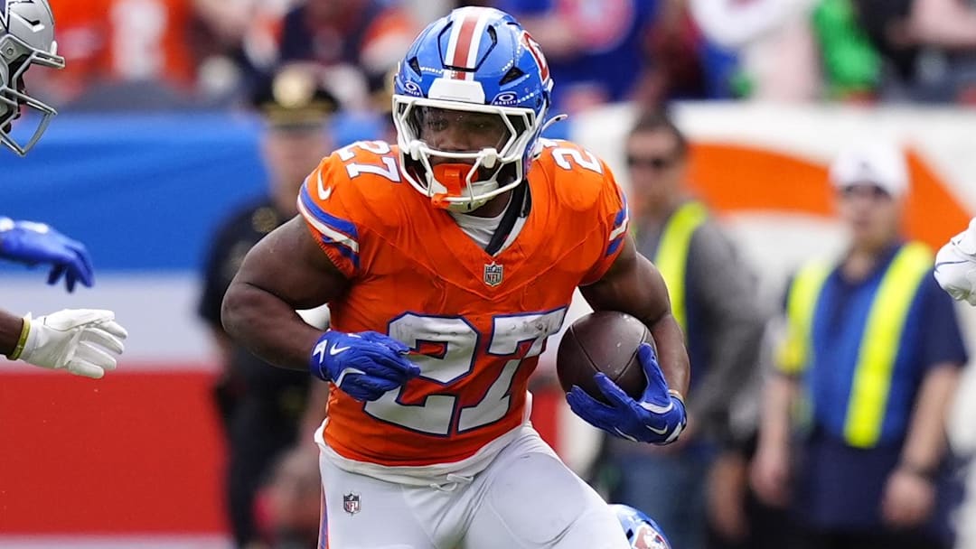 Oct 26, 2025; Denver, Colorado, USA; Denver Broncos running back J.K. Dobbins (27) runs against the Dallas Cowboys in the first half at Empower Field at Mile High. 