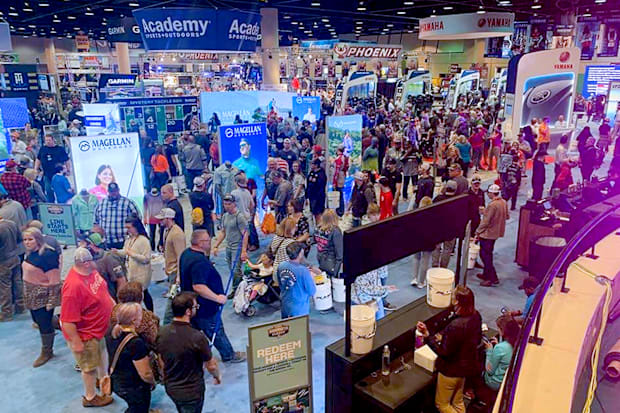 An overhead view of the Bassmaster Classic Expo filled with manufacturer's displays and people.