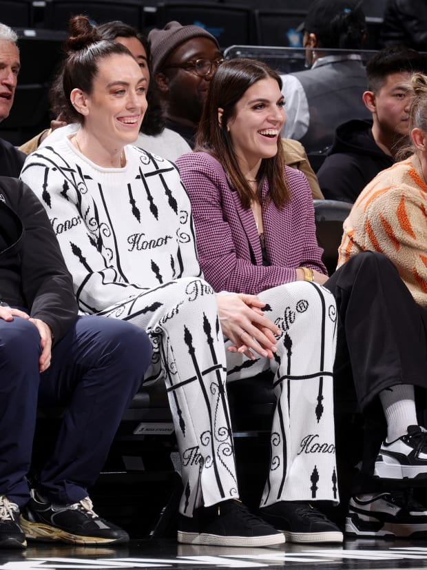 Breanna Stewart and her wife Marta sit court side at a Brooklyn Nets game in February 2023. 