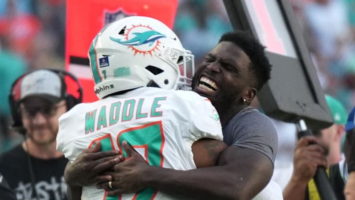 Miami Dolphins wide receiver Tyreek Hill, right, hugs Miami Dolphins wide receiver Jaylen Waddle