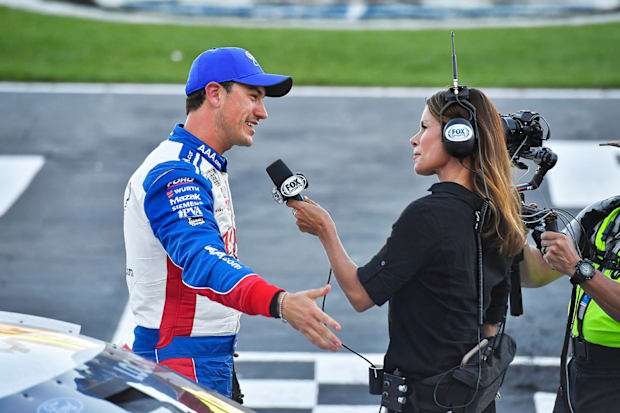 As a pit reporter, Little is in on the action throughout the race and interviews drivers, such as Joey Logano.