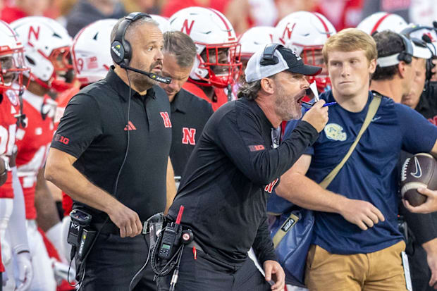 Nebraska defensive coordinator John Butler shouts as head coach Matt Rhule looks on during the Huskers' 2025 game against