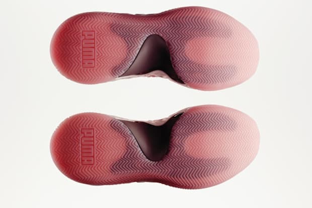 Pink PUMA basketball shoe outsoles.