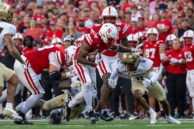 Nebraska running back Rahmir Johnson rushes for an 11-yard gain during the first quarter against Colorado.