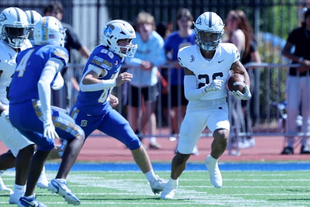 St. John Bosco freshman wide receiver Darren Tubbs carrying the ball against San Mateo Serra.