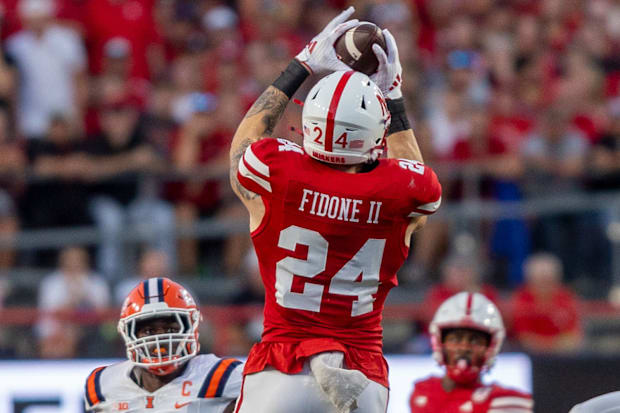 Nebraska tight end Thomas Fidone II catches a pass that turns into a 17-yard gain against Illinois.