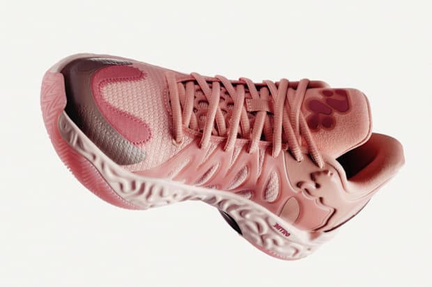Pink PUMA basketball shoes.