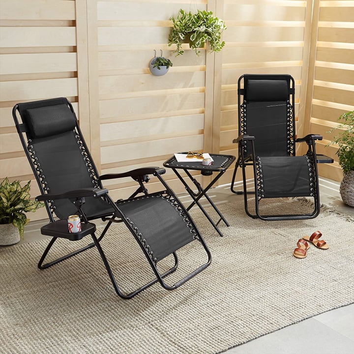Amazon Basics Textilene Adjustable Zero-Gravity Folding Reclining Lounge Chairs, Set of 2 in black.