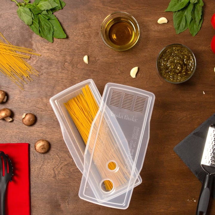 The Original Fasta Pasta Microwave Pasta Cooker on a wood countertop.