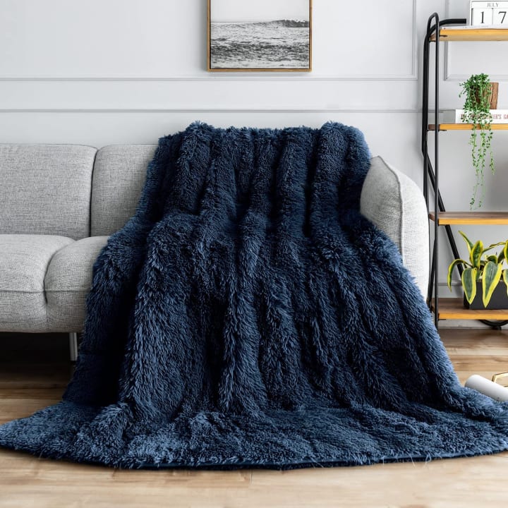 A great gift for insomniacs is the Uttermara Sherpa Weighted Blankets pictured here.
