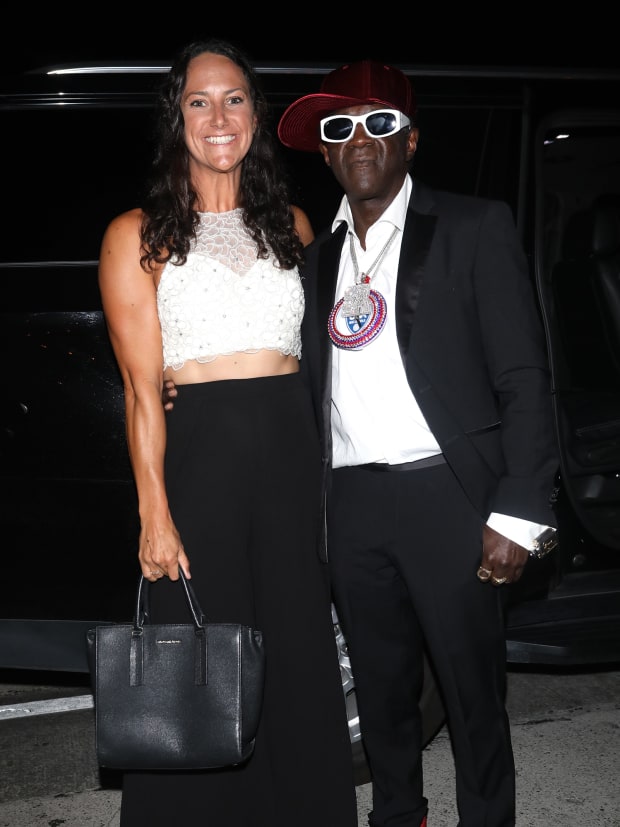 U.S. water polo player Maggie Steffens poses with rapper Flavor Flav.