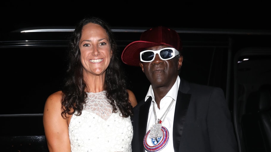 U.S. water polo player Maggie Steffens poses with rapper Flavor Flav.
