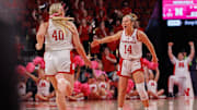 Nebraska guard Callin Hake (14) celebrates with center Alexis Markowski (40) during an overtime win over Oregon in Lincoln on Feb. 19, 2025.