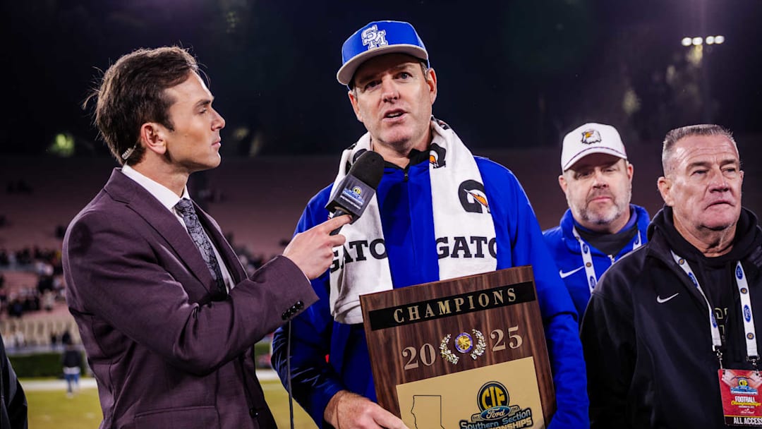 Santa Margarita football coach Carson Palmer holds the CIF Southern Section Division 1 plaque after his Eagles beat Corona Centennial in the final at the Rose Bowl. Santa Margarita football coach Carson Palmer holds the CIF Southern Section Division 1 plaque after his Eagles beat Corona Centennial in the final at the Rose Bowl.