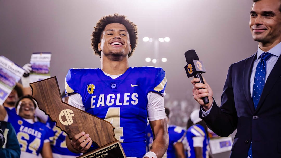 Trent Mosley holds the CIF State Open Division trophy after helping Santa Margarita beat De La Salle 47-13 at Saddleback College on December 13, 2025.