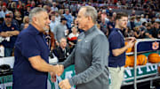 Auburn coach Bruce Pearl, left, and Tennessee coach Rick Barnes shake hands before a March 4, 2023, game in Auburn, Ala. Pearl and Barnes rank among the top active college basketball coaches to never win a Division I championship.