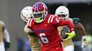 Duncanville's Trenton Yancey runs away from a defender in a game against Dallas South Oak Cliff earlier this year. 