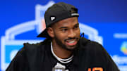 Shedeur Sanders speaks with reporters at the NFL scouting combine.