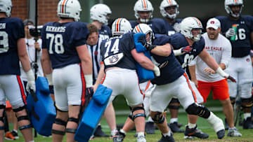 Auburn Tigers offensive line runs drills during Auburn Tigers football practice at the Woltosz Football Performance Center at in Auburn, Ala., on Monday, April 3, 2023.