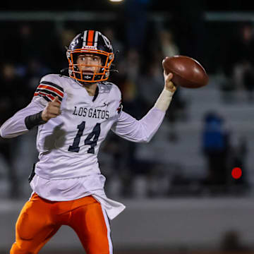Los Gatos senior quarterback Scotty Brennan (14), shown here in a game versus Palo Alto in 2024, Saturday threw for more than 300 yards and three touchdowns in the Wildcats' stirring 35-28 win at third-seed Riordan in a CCS Division 1 semifinal game. 