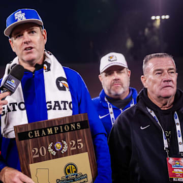 Santa Margarita football coach Carson Palmer holds the CIF Southern Section Division 1 plaque after his Eagles beat Corona Centennial in the final at the Rose Bowl.