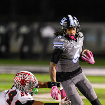 Hough senior wide receiver Jayden White avoids a South Mecklenburg tackler in a 42-10 win